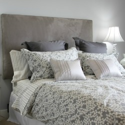 Luxury master bedroom done in grey.