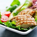 closeup of healthy salad with grilled chicken fillet, selection of