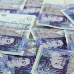 Close up of twenty pound banknotes forming background