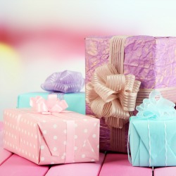 Beautiful bright gifts, on bright wooden table