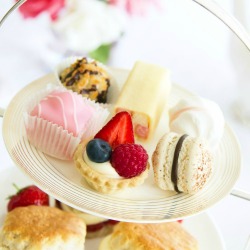 Afternoon tea served with an assortment of cakes