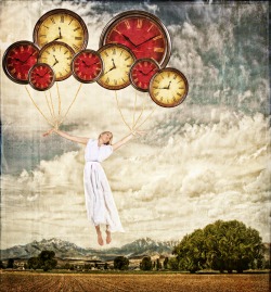 Woman tied to clocks floating away on an antique or grunge background, time concept