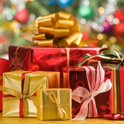 golden and red christmas gifts close up