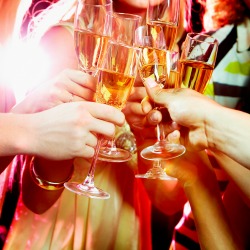 Close-up of people making good cheer
