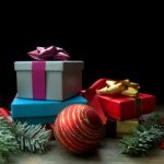 Christmas background with tree branches and decorations on wood with space