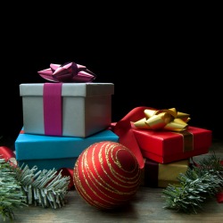Christmas background with tree branches and decorations on wood with space