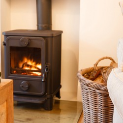 Wood burning stove and christmas ornaments in a modern living room