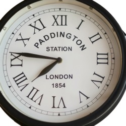 Old clock of Paddington Station in London with roman numbers